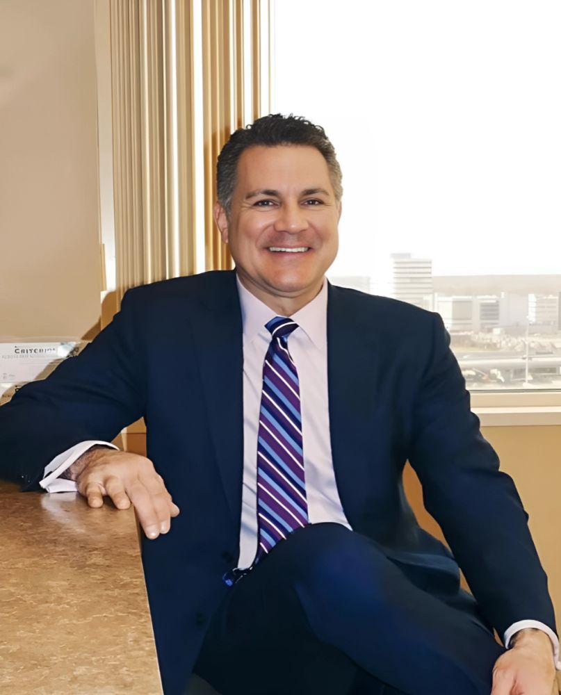 Dr. John Trupiano in suit at Trupiano Plastic Surgery